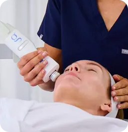 a woman getting a facial massage from rejuvimed doctor